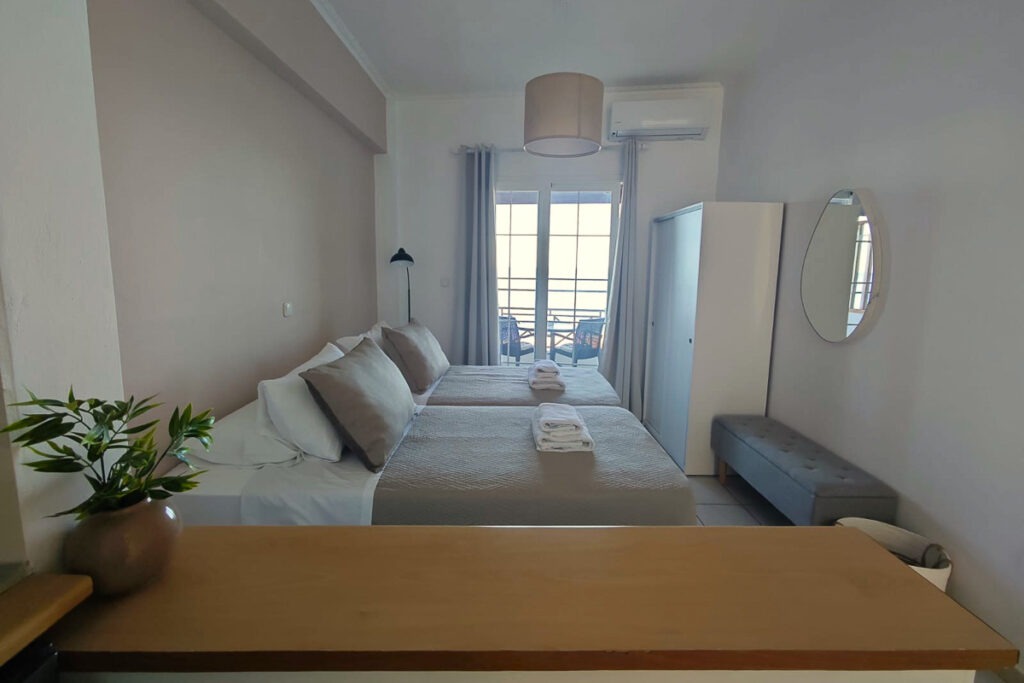 Galfki's bedroom area with two large single beds next to each other.