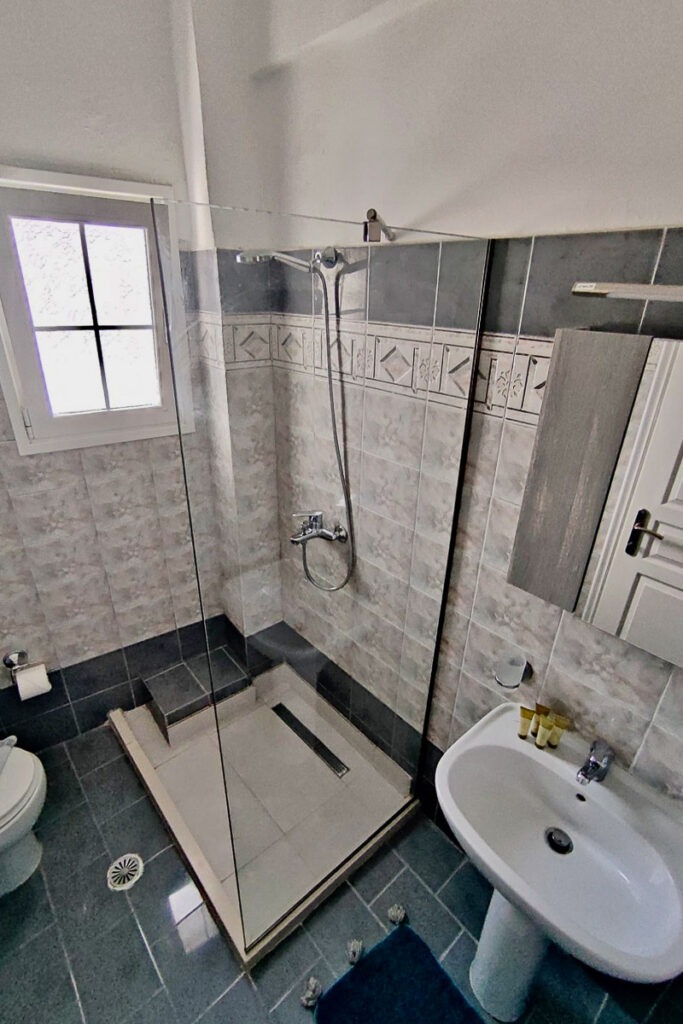 The bathroom in Pasithea one-bedroom apartment.